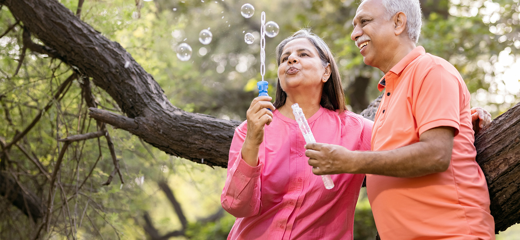 Older Couple Blowing Bubbles