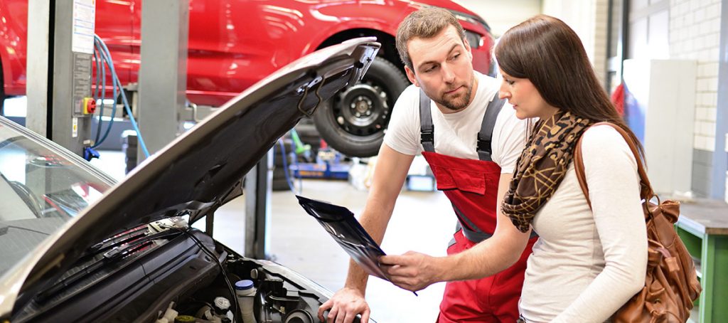 Woman Talking with Car Mechanic